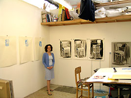 Polly Nuttall in her studio with chair paintings
